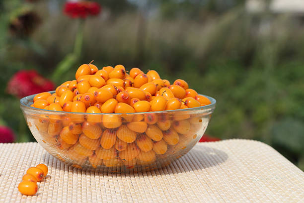 istock Sea buckthorn in a glass plate on a table 486395774