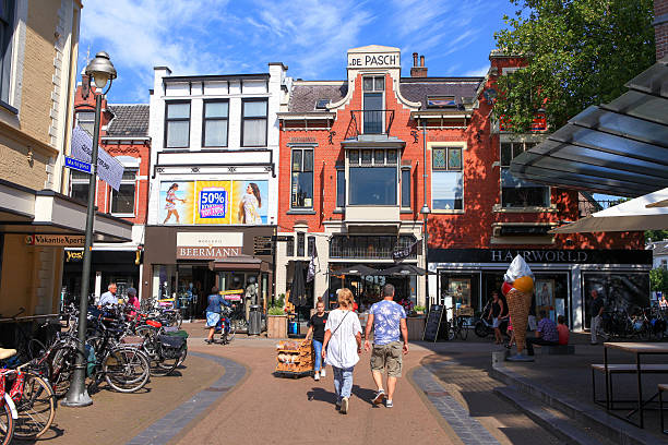 Apeldoorn, The Netherlands - August 22, 2015: People at Apeldoorn's Markstraat main street, known as a popular shopping street for locals and tourists. with people.