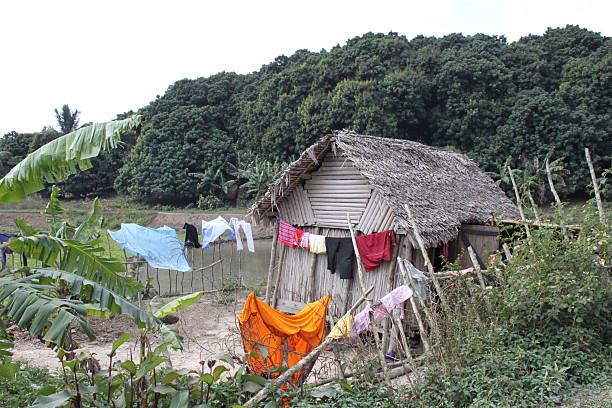 istock Tropical shack on a river bed with hanging laundry 486395956