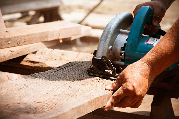 istock electric saw cutting wood 486397021