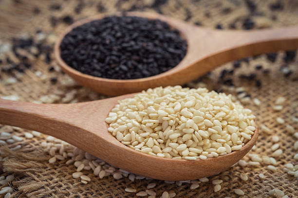 istock White sesame and black sesame seed on wooden spoon 486400290