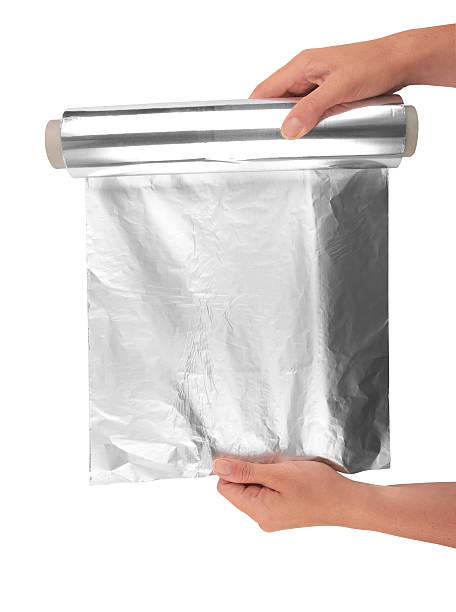 papier aluminium - rolled up foil paper gray photos et images de collection