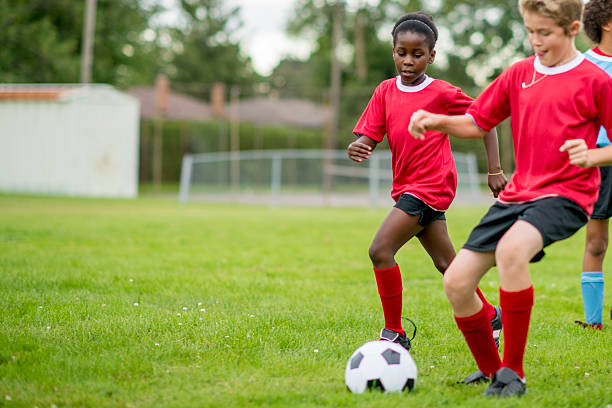 istock Dribbling A Soccer Ball 486401406