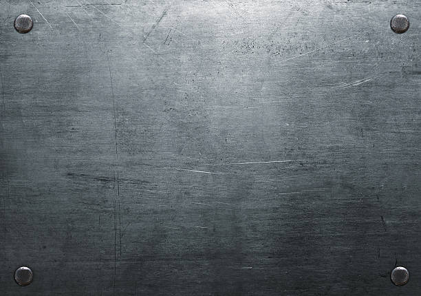 Scratched metal plate Dark metal background with rivets sheet metal stock pictures, royalty-free photos & images