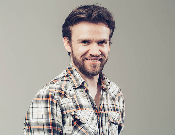 istock Man beard portrait smiling  plaid shirt studio 486407598