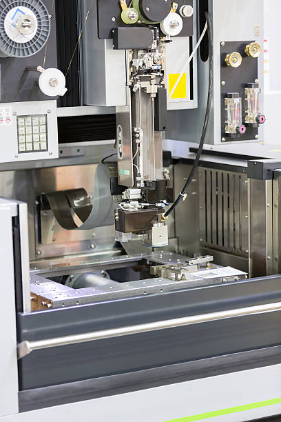 istock CNC wire cut machine cutting mold parts 486409498