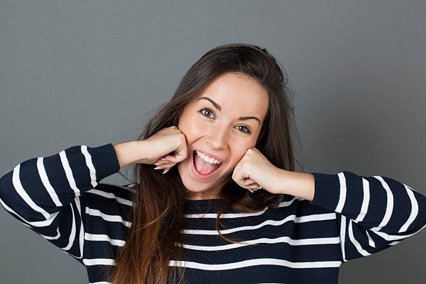 istock playful young girl expressing amazement 486413236