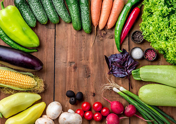 istock The multicolored vegetables on wooden table 486413378