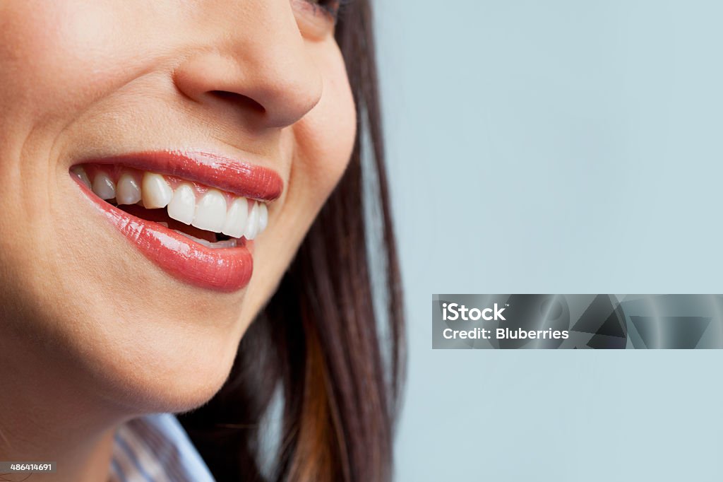 Female Smile Detail of a toothy smile. Adult Stock Photo