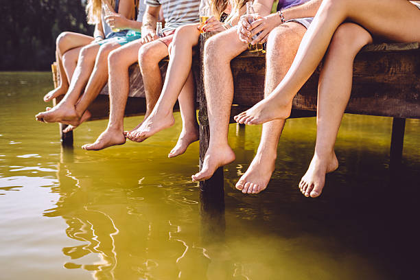 istock Close up of feet on a jetty 486414707