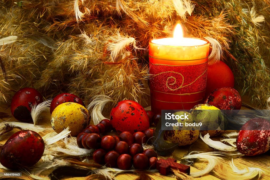 Easter eggs with candle and down Easter eggs with candle and down, spring theme Animal Egg Stock Photo