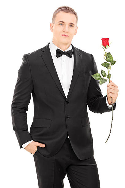 istock Well dressed man holding a red rose 486416765