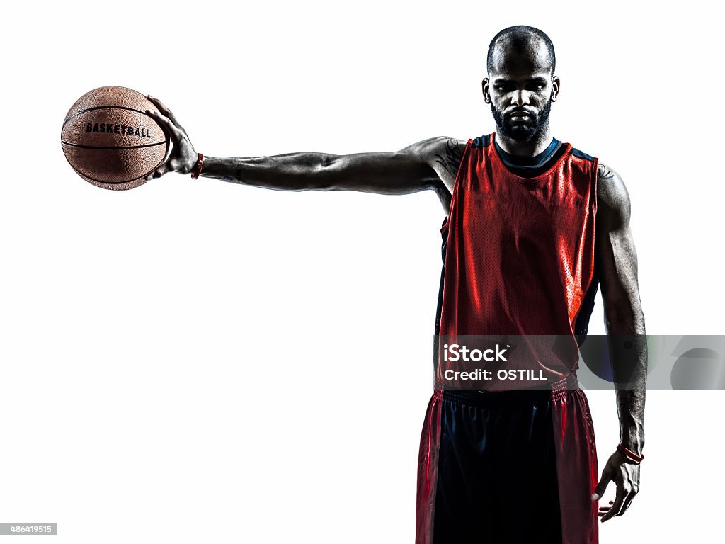 african man basketball player silhouette one african man basketball player holding ball in silhouette white background Basketball Player Stock Photo