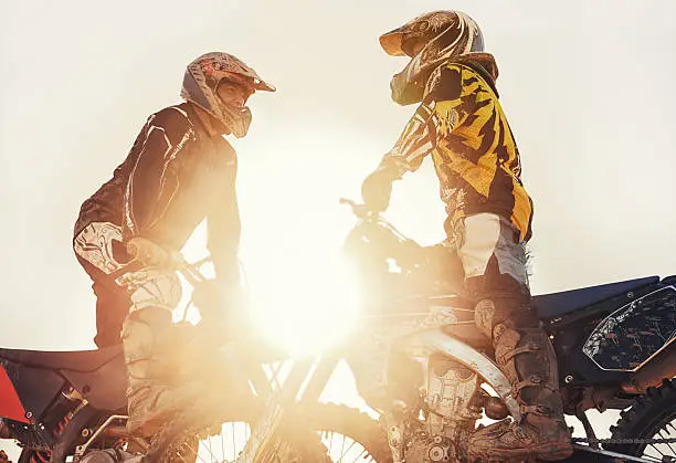 Shot of two motocross riders out on the track against the setting sunhttp://195.154.178.81/DATA/i_collage/pi/shoots/783228.jpg
