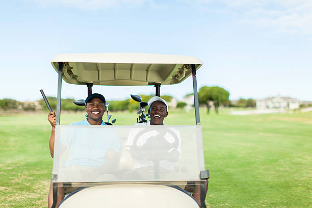 istock African golfers driving to their next location 486422119