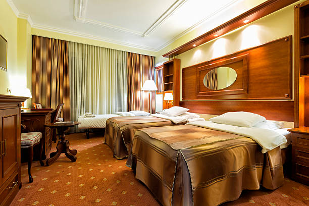 istock Elegant hotel twin bedroom with an extra bed 486424302