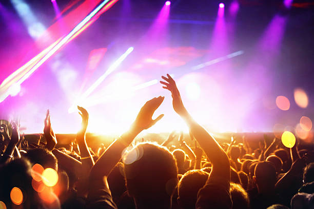 istock People at concert party. 486424704