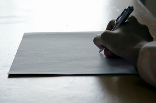 Hand Writing Shines Dim Light Shines On Hand Writing Stock Photo - Download Image Now ...