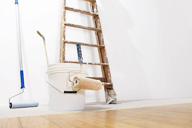 istock painter wall concept, ladder, bucket, roll paint on the floor 486425154