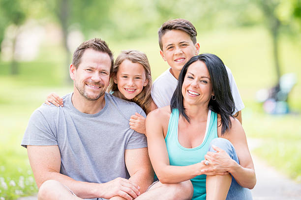istock Family Sitting at the Park 486425638