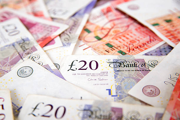 Sterling currency, British Pound Sterling A stack of bundled British Pound Sterling banknotes, British Currency, Pound Symbol, Currency, UK, Paper Currency, Currency, Finance, british currency stock pictures, royalty-free photos & images