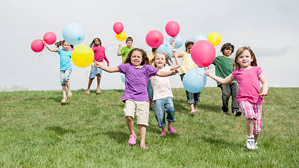 istock Children Running with Balloons 486425982