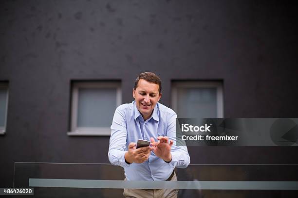 Businessman Using Mobile Phone Stock Photo - Download Image Now - 2015, 30-39 Years, Adult