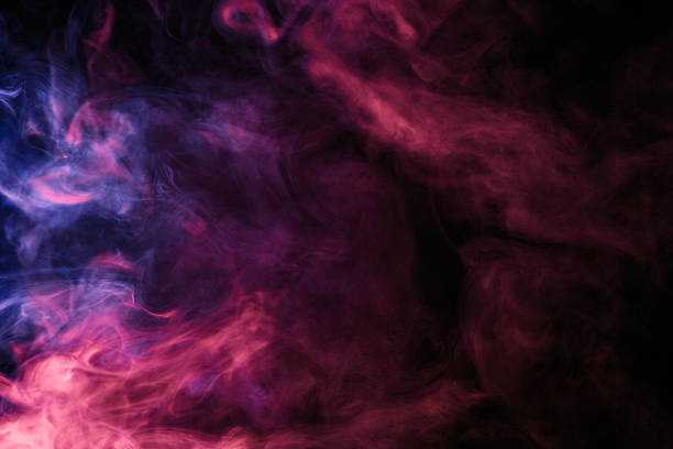 Abstract colored smoke hookah on a black background. stock photo