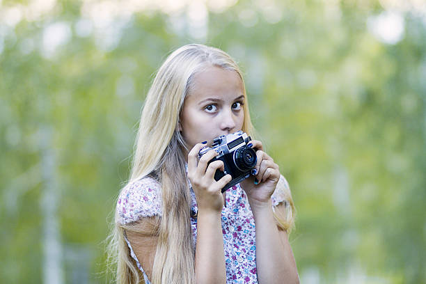 istock Young woman photographer in a forest 486426384
