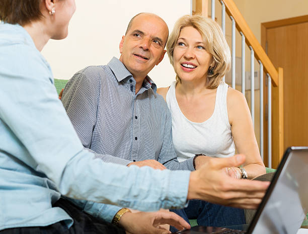 istock happy couple answer questions of social worker 486426848