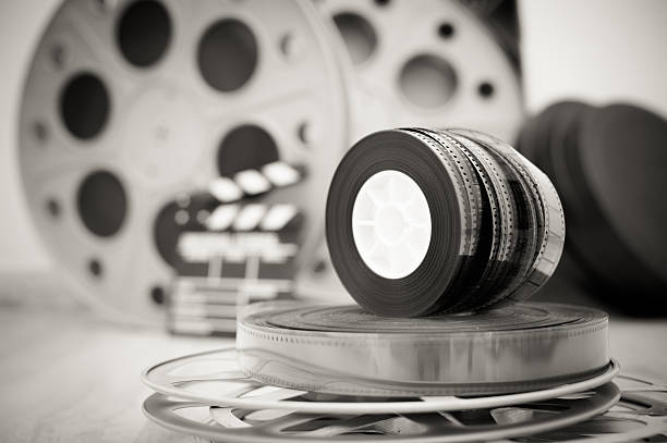istock 35 mm movie reels with clapper and boxes in background 486435940