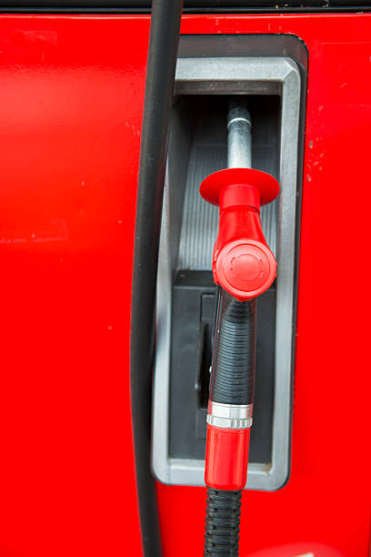 istock red fuel nozzle at gas station 486436698