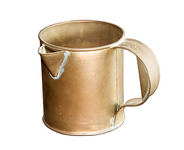 istock Antique Brass jug isolated on white 486437572