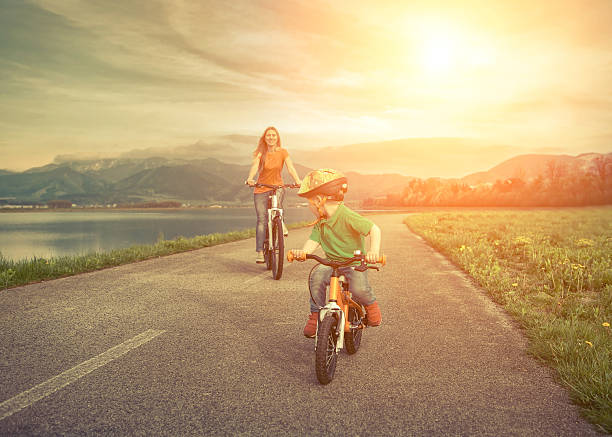 istock Mother and son on the bicycles funning outdoor 486437982