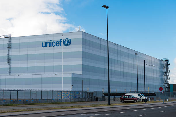 UNICEF - Copenhagen, Denmark Copenhagen, Denmark - June 20, 2015: View of the Unicef building and parking lot. The building accommodates the new global warehouse of the United Nations Children's Fund, Unicef in Copenhagen, Denmark unicef stock pictures, royalty-free photos & images