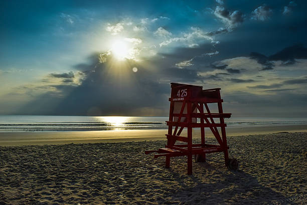 istock Lifeguard Chair at Sunrise on Beach 486439004