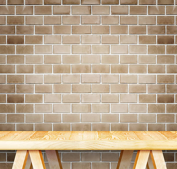 istock Empty wood modern table and grunge brown brick wall 486439178