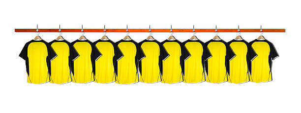 Row of Yellow and Black Football Shirts stock photo