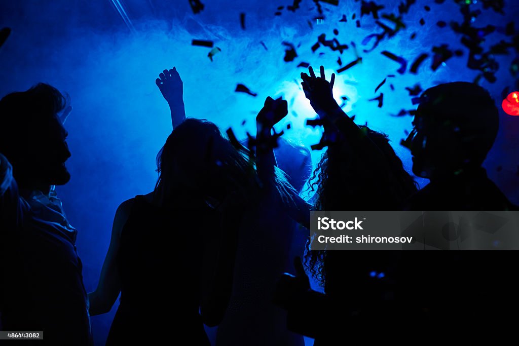 Motion and dance Silhouettes of people clubbing at night Clubbing Stock Photo