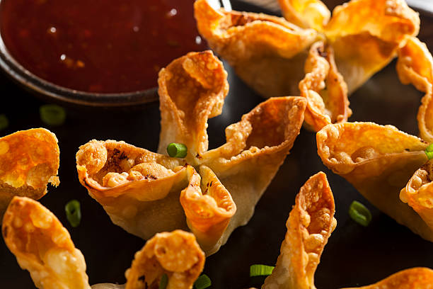 Asian Crab Rangoons with Sweet and Sour Sauce Homemade Asian Crab Rangoons with Sweet and Sour Sauce yangon photos stock pictures, royalty-free photos & images