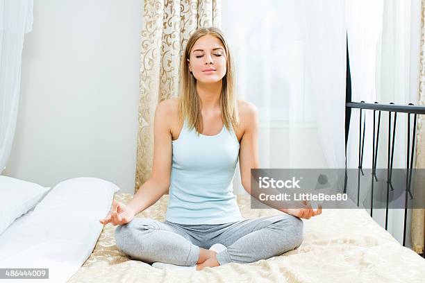 Woman Meditating Stock Photo - Download Image Now - 20-24 Years, Adult, Adults Only