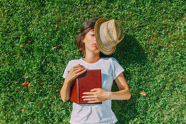 istock Girl hipster rests on the field 486444025