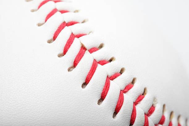 Close up of a baseball Close up of a baseball baseball threads stock pictures, royalty-free photos & images