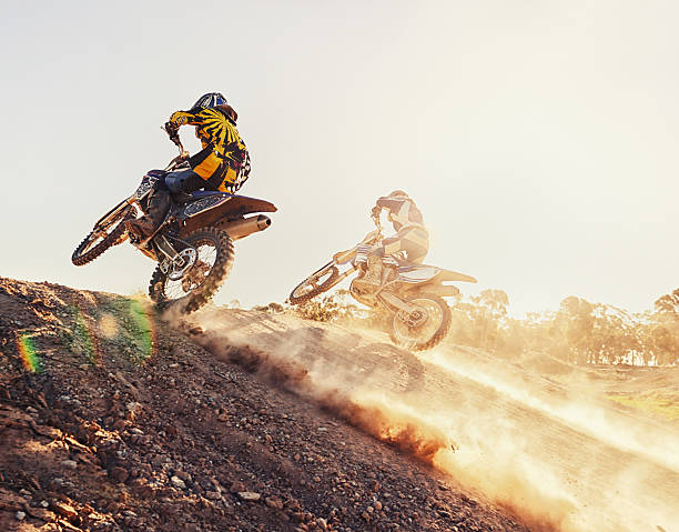 Going into the final corner A shot of two dirtbike racers going head-to-head on the trackhttp://195.154.178.81/DATA/i_collage/pi/shoots/783228.jpg adrenaline stock pictures, royalty-free photos & images