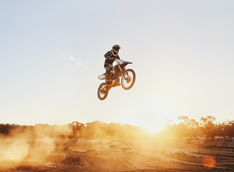 A shot of a motocross rider in midair during a race