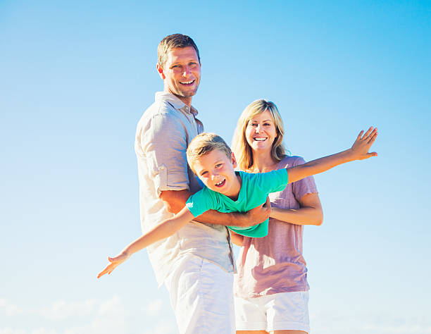 istock Family Playing on the Beach 486450176