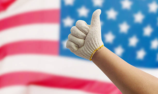 istock Labor hand on the USA Flag 486450568