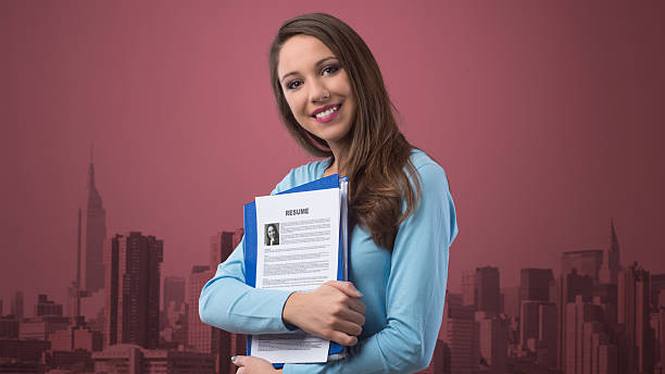 istock Young woman holding her resume 486454962