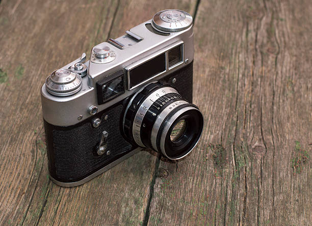 istock retro the camera on an old wooden table 486457026