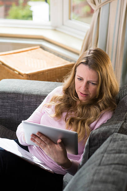 istock mature woman online 486459644
